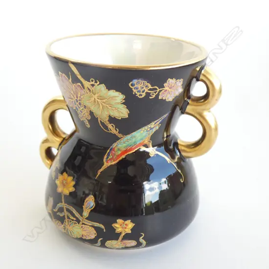 A Carlton ware enamelled vase, kingfisher and water lily on black ground